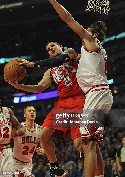 Jordan Farmar of the New Jersey Nets puts up a shot against Joakim Noah of the Chicago Bulls at the United Center on January 23, 2012 in Chicago,...