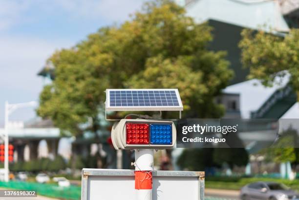 warning light using solar panel charging - hazard light stock pictures, royalty-free photos & images