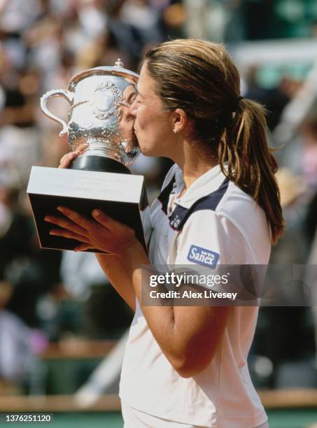 Jennifer Capriati from the United States kisses the Coupe Suzanne Lenglen trophy after winning the Women's Singles Final match against Kim Clijsters...