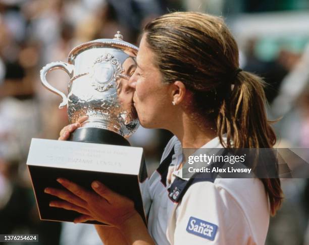 Jennifer Capriati from the United States kisses the Coupe Suzanne Lenglen trophy after winning the Women's Singles Final match against Kim Clijsters...