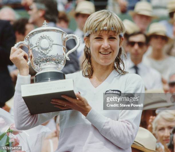 Chris Evert Lloyd from the United States holds the Coupe Suzanne Lenglen trophy after winning the Women's Singles Final match against Mima Jausovec...