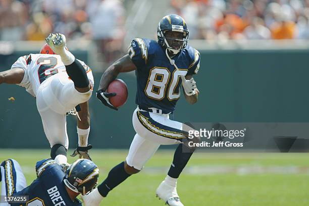 Wide receiver Curtis Conway of the San Diego Chargers runs a reverse during the NFL game against the Cincinnati Bengals on September 8, 2002 at Paul...