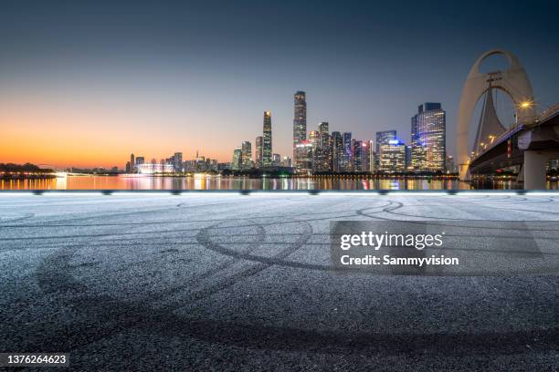 empty road against urban skyline - guangzhou stock pictures, royalty-free photos & images