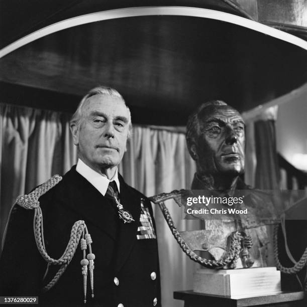 Louis Mountbatten, 1st Earl Mountbatten of Burma with a bust of himself by sculptor John Doubleday, UK, 19th December 1974.