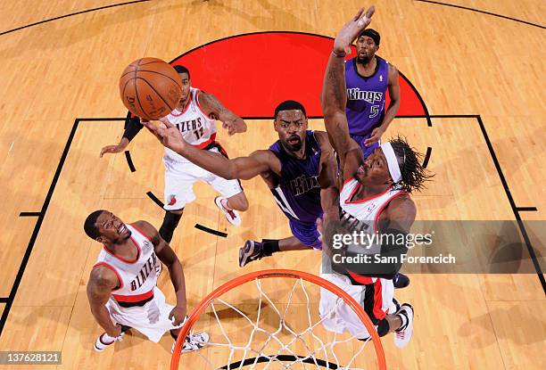 Gerald Wallace of the Portland Trail Blazers attempts to block the shot of Tyreke Evans of the Sacramento Kings during the game on January 23, 2012...