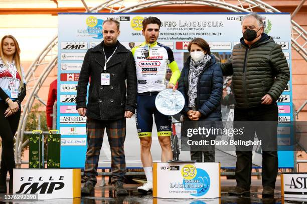 Lorenzo Rota of Italy and Team Intermarché - Wanty - Gobert Matériaux celebrates winning the trophy for the most combative rider on the podium...