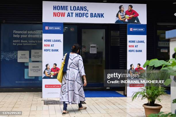 Customer walks into a Housing Development Finance Corporation bank branch in Mumbai on July 1, 2023.