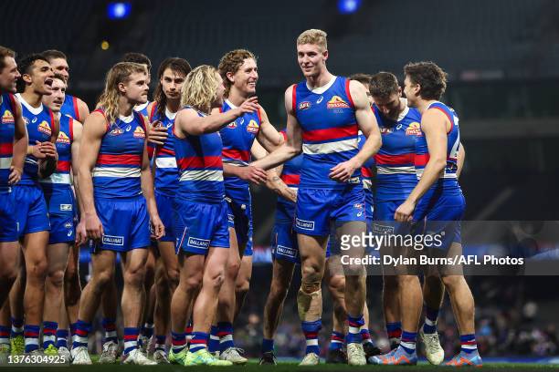 Tim English of the Bulldogs leads the team off the field during the 2023 AFL Round 16 match between the Western Bulldogs and the Fremantle Dockers at...