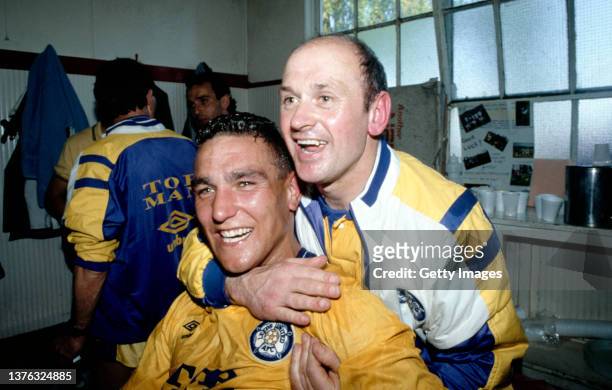 Leeds United physio Alan Sutton pictured celebrating with Vinnie Jones in the changing room after Leeds had gained promotion to the top flight after...