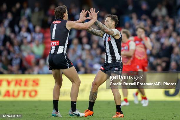 Jamie Elliott of the Magpies celebrates a goal during the 2023 AFL Round 16 match between the Gold Coast Suns and the Collingwood Magpies at Heritage...