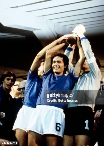 Claudio Gentile of Italy holds aloft the World Cup with team captain and goalkeeper Dino Zoff after Italy's victory over West Germany in the 1982...