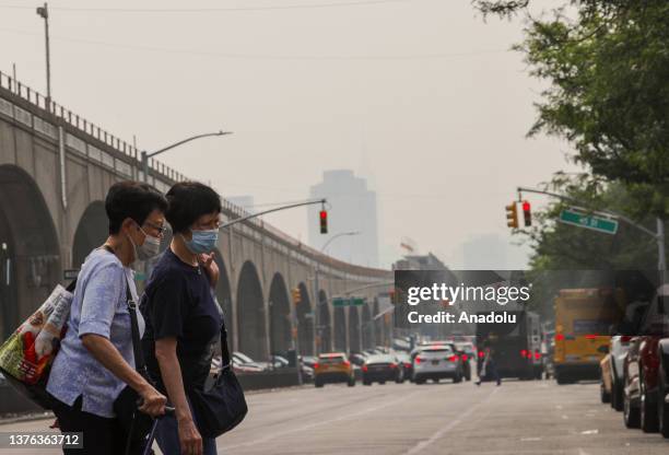 View of the city as smoke from wildfires in Canada shrouds sky on June 30, 2023 in New York City, United States. Canadian wildfires smoke creating a...