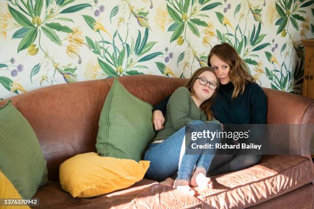 mother and daughter hugging - richard gentles stock pictures, royalty-free photos & images