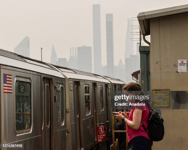 View of the city as smoke from wildfires in Canada shrouds sky on June 30, 2023 in New York City, United States. Canadian wildfires smoke creating a...