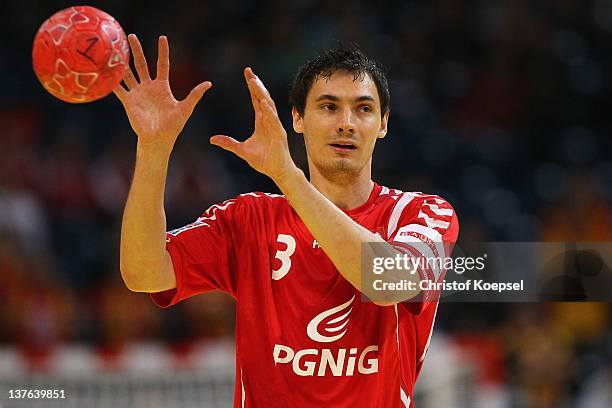 Krzysztof Lijewski of Poland passes the ball during the Men's European Handball Championship second round group one match between Poland and...