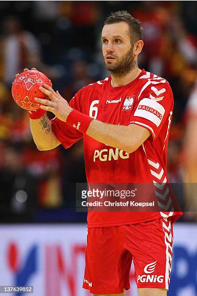 Grzegorz Tkaczyk of Poland passes the ball during the Men's European Handball Championship second round group one match between Poland and Macedonia...