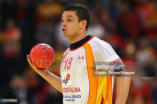 Naumche Mojsovski of Macedonia passes the ball during the Men's European Handball Championship second round group one match between Poland and...