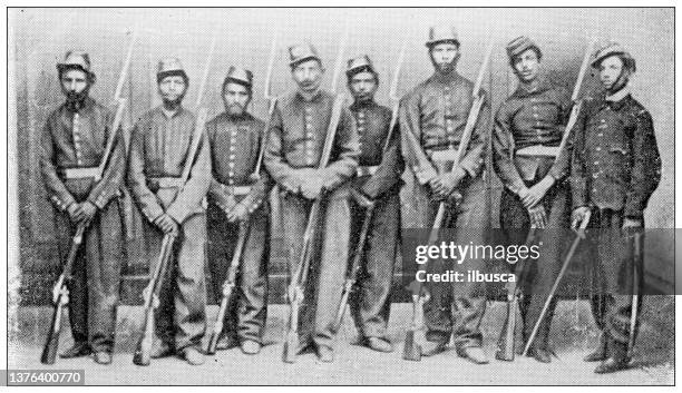 antique travel photographs of mexico: squad of soldiers - mexico black and white stock illustrations