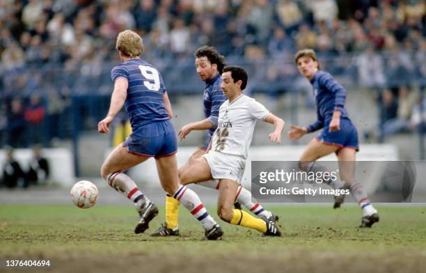 Spurs player Ossie Ardiles is crowded out by Kerry Dixon and Mickey Thomas during the First Division match between Chelsea and Tottenham Hotspur at...