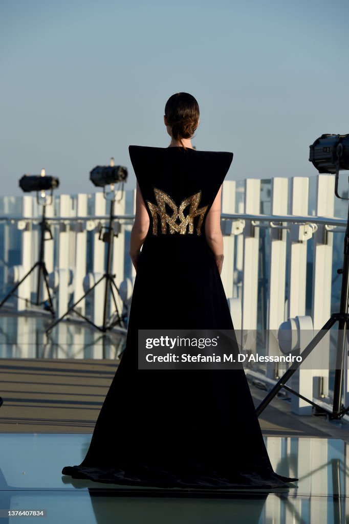 J Spring A model walks the runway at the J Spring fashion show on the Costa ...