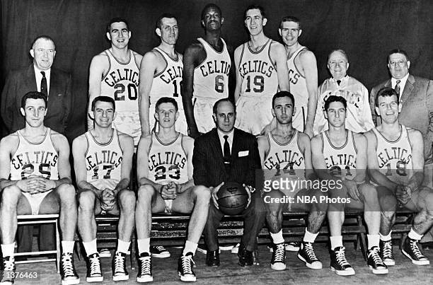 The World Champions of basketball Boston Celtics pose for a team portrait front row : Lou Tsioropoulos, Andy Phillip, Frank Ramsey, Head Coach Red...