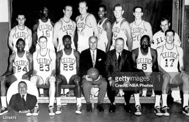 The World Champions of basketball Boston Celtics pose for a team portrait seated : Sam Jones, Fran Ramsey, K. C. Jones Head Coach Red Auerbach,...