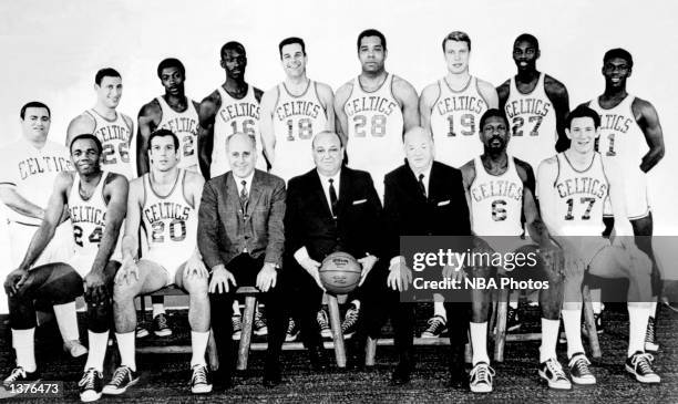 The World Champions of basketball Boston Celtics pose for a team portrait front row : Sam Jones, Larry Siegfried, G. M. Red Auerbach, Chairman of...