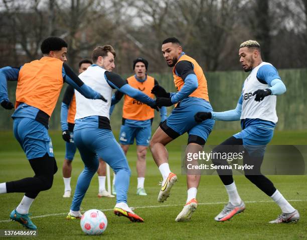 Players seen L-R Jamal Lewis, Chris Wood, Jamaal Lascelles and Joelinton jostle for the ball during the Newcastle United Training Session at the...
