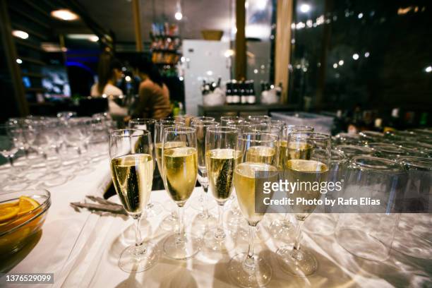 champagne glasses on the bar counter - banquet hall stock pictures, royalty-free photos & images