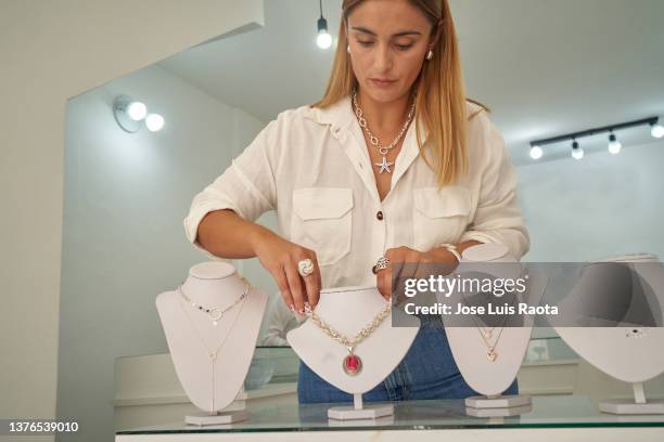 silver jewelry woman business owner - jewellery shop stock pictures, royalty-free photos & images