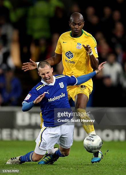 Kenny Miller of Cardiff City goes down under the challenge from Anthony Gardner of Crystal Palace during the Carling Cup Semi Final second leg match...