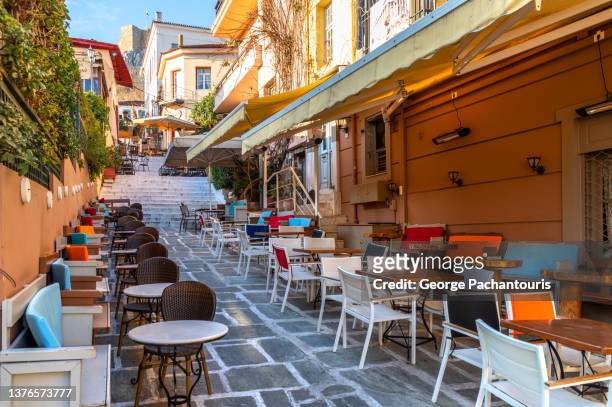 outdoors cafe in the old town of athens, greece - plaka greek cafe stock pictures, royalty-free photos & images