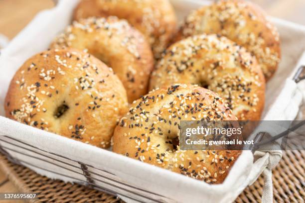 homemade bagels in a canvas basket - bagels stock pictures, royalty-free photos & images