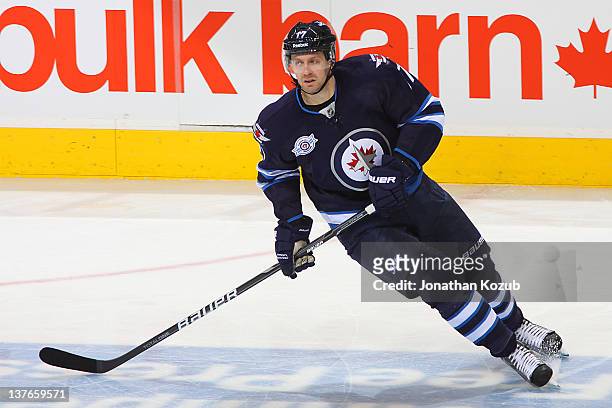 Eric Fehr of the Winnipeg Jets skates through the neutral zone during third period action period against the Buffalo Sabres at the MTS Centre on...