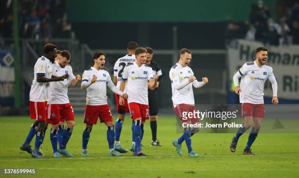 Hamburg SV players celebrate after their sides victory in the penalty shoot out during the DFB Cup quarter final between Hamburger SV and Karlsruher...