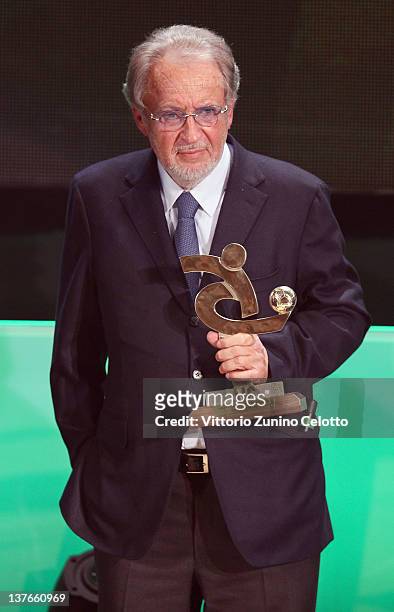 Giampaolo Pozzo poses with the AIC Award during the Gran Gala del calcio Aic 2011 awards ceremony at Teatro dal Verme on January 23, 2012 in Milan,...