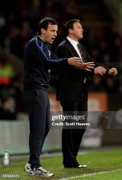 Dougie Freedman the manager of Crystal Palace reacts to events on the pitch as Malky Mackay the Cardiff City manager looks on during the Carling Cup...