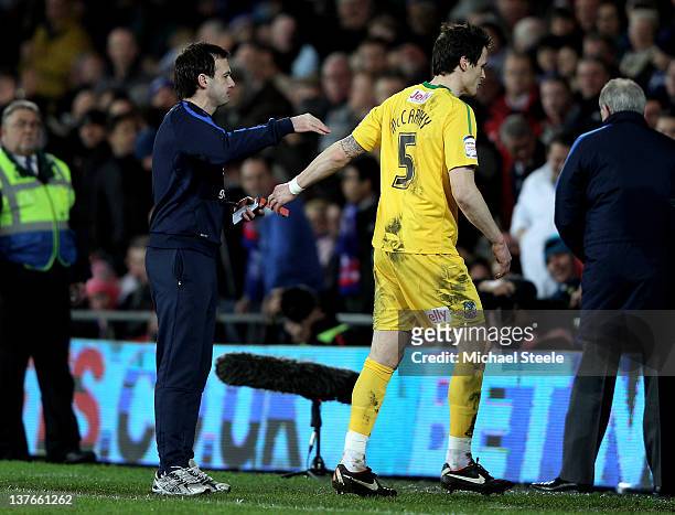 Patrick McCarthy of Crystal Palace is consoled by his manager Dougie Freedman after he is shown the red card by Referee Howard Webb during the...