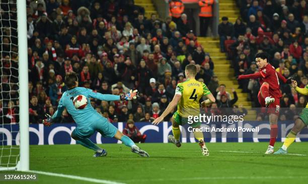 Takumi Minamino of Liverpool scores the first goal during the Emirates FA Cup Fifth Round match between Liverpool and Norwich City at Anfield on...