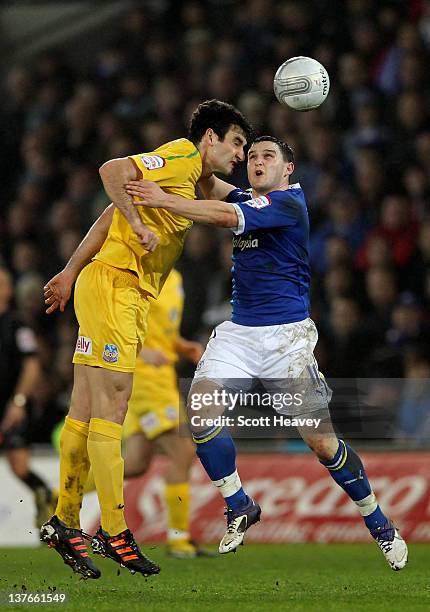 Mile Jedinak of Crystal Palace wins a header under pressure from Craig Conway of Cardiff City during the Carling Cup Semi Final second leg match...