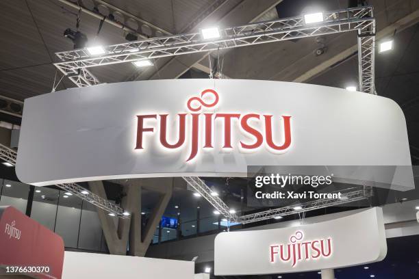 Logo sits illuminated at the Fujitsu booth on day 3 of the GSMA Mobile World Congress on March 02, 2022 in Barcelona, Spain. This year the Mobile...