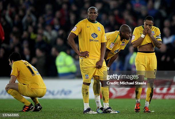 Dejected Crystal Palace players react following their team's 3-1 defeat in the penalty shootout during the Carling Cup Semi Final second leg match...