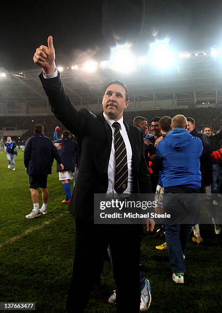 Malky Mackay the Cardiff City manager applauds the fans following his team's 3-1 victory in the penalty shootout during the Carling Cup Semi Final...