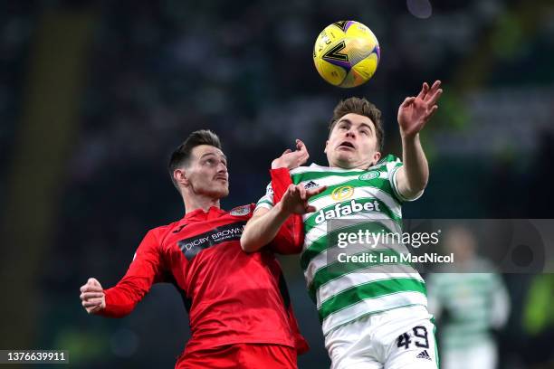 Scott Tanser of St Mirren battles for possession with James Forrest of Celtic during the Cinch Scottish Premiership match between Celtic FC and St....