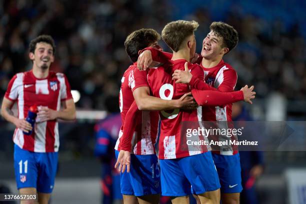 Pablo Barrios of Atletico de Madrid celebrates with team mates after scoring their team's third goal during the UEFA Youth League Round Of Sixteen...
