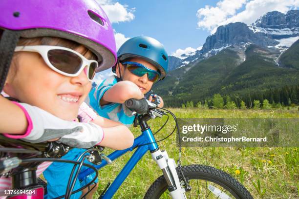 sibling cycling - canmore stockfoto's en -beelden