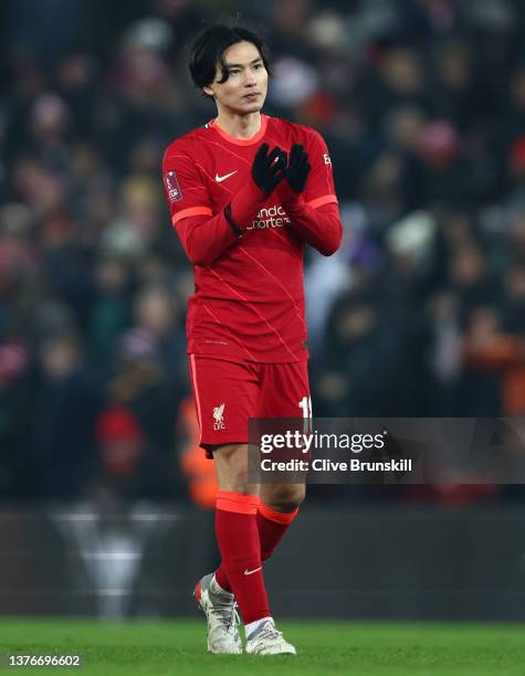 Takumi Minamino of Liverpool applauds fans after their sides victory during the Emirates FA Cup Fifth Round match between Liverpool and Norwich City...