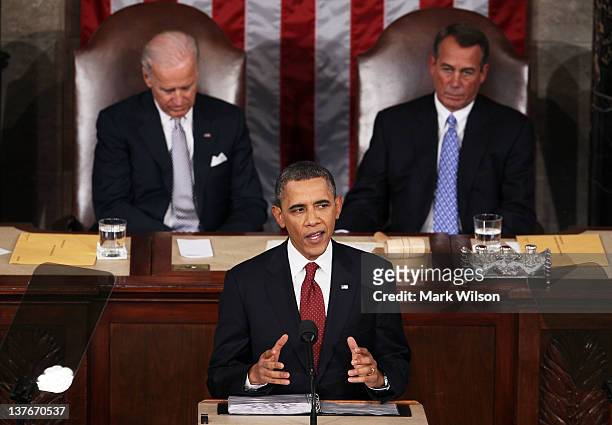 President Barack Obama, flanked by Vice President Joe Biden and Speaker of the House John Boehner delivers his State of the Union speech on January...