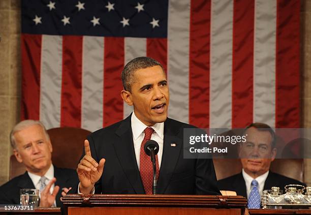 President Barack Obama, flanked by Vice President Joe Biden and House Speaker John Boehner , delivers his State of the Union address before a joint...
