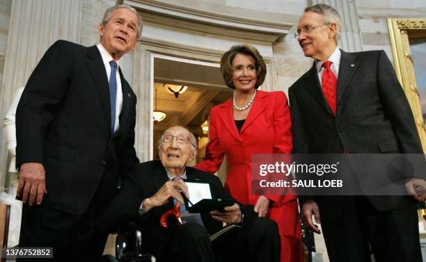 President George W. Bush , Speaker of the House Nancy Pelosi and Senate Majority Leader Senator Harry Reid present the Congressional Gold Medal to Dr...